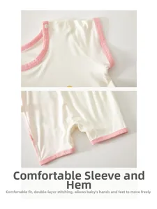 Macro view of baby cotton bodysuit featuring reinforced seams and soft pink piping