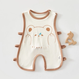 Detail view of cotton baby bodysuit showing bear print and side strap closures