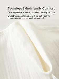 White ribbed cotton baby romper with smooth flatlock seams for infant skin comfort