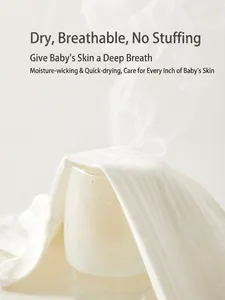 White cotton baby bodysuit showing high breathability with visible water steam demonstration