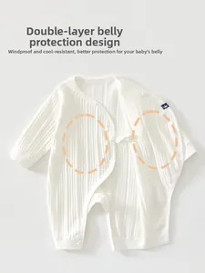 Detail view of white ribbed cotton baby romper with double-layer belly protection design