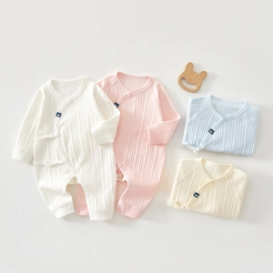 Flat lay of soft rib-knit cotton baby bodysuits in four pastel colors with tie-up closure