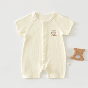 Detail of soft 100% cotton newborn romper with hi bear print and snap buttons