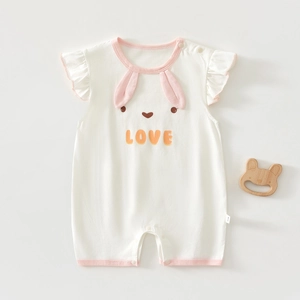 Detailed view of baby romper with pink rabbit ears, flutter sleeves and snap closures
