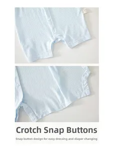 Detail view of crotch snap buttons on light blue ribbed newborn cotton romper