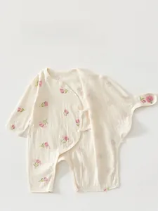 Detail of newborn tulip print cotton jumpsuit with double-layer belly protection design