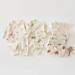 Close-up of baby romper showing breathable cotton fabric and cute cartoon prints