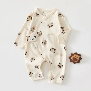 Close-up of baby romper showing breathable cotton crepe fabric and cute panda pattern