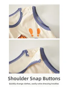 Close-up of shoulder snap buttons on a sleeveless cotton baby bodysuit in cream