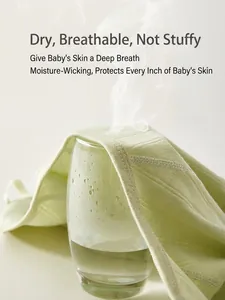 Breathable light green cotton newborn kimono top showing steam passing through fabric