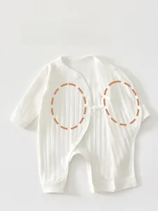 Detail view of baby bodysuit with double-layer belly protection and soft ribbed cotton fabric