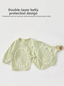 Detail of newborn cotton wrap top featuring double-layer tummy protection and knit texture