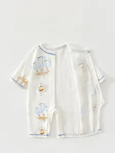 Detail of baby romper with snap buttons, cartoon bears, and hot air balloon prints