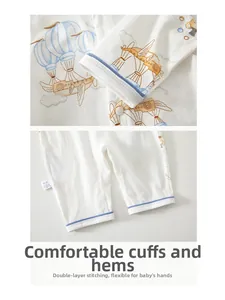Close-up of baby romper cuffs with blue piping and durable double-stitched seams