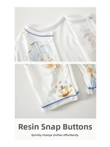 Close-up of resin snap buttons on breathable summer baby romper with bear and balloon print