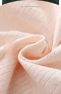 Close-up of 100% cotton breathable pointelle fabric for soft baby summer clothing