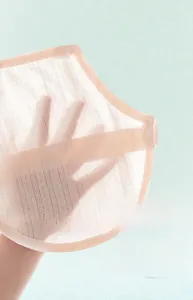 Close-up of light pink breathable mesh cotton baby belly band with snap button