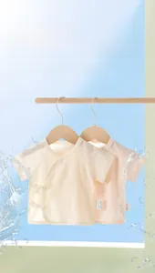 Detail of short-sleeve newborn cotton tops with breathable mesh and side-tie design