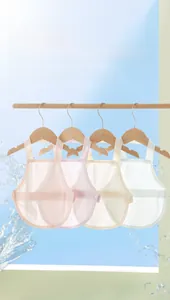 Detail of four-color breathable cotton baby belly bands hanging on wooden hangers