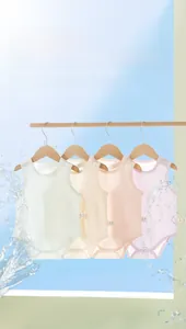 Detail of four-piece sleeveless baby bodysuits in ribbed cotton with snap button closure