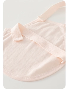Detail of pink cotton baby belly wrap with hollow breathable mesh and snap button closure