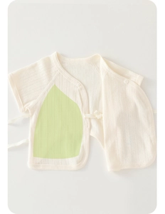 Detailed close-up of newborn short sleeve kimono top in soft cotton with side tie closure