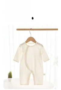 Detailed view of breathable ribbed cotton baby romper with diagonal snap button closure