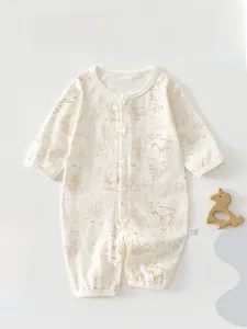 Close-up of baby bodysuit featuring forest animal prints and full snap buttons