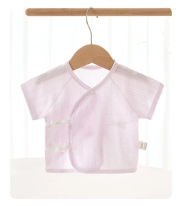 Detail of baby kimono short sleeve top in light pink with lace and ribbon ties