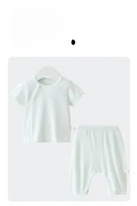 Detail of baby cotton summer set showing breathable ribbed fabric and side snap buttons