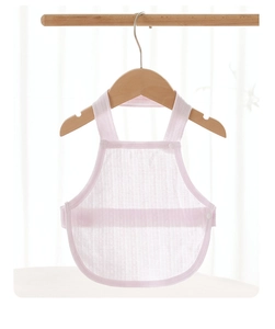 Close-up of baby pink mesh cotton belly wrap with snap buttons on a wooden hanger