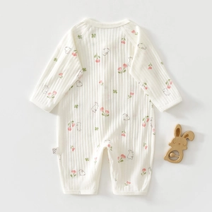 Close-up of baby romper featuring ribbed cotton fabric and cute rabbit floral patterns