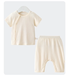 Detail view of cotton baby summer set with ribbed texture and side snap button closure