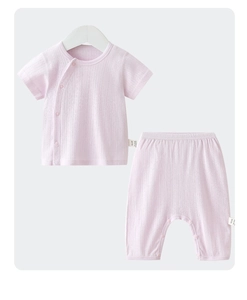 Detailed view of pink baby summer set featuring breathable vertical jacquard cotton fabric