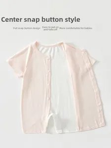 Close-up of pink baby romper with full snap buttons and breathable ribbed knit texture