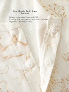 Detail of baby romper featuring POM food-grade resin snap buttons on cotton fabric