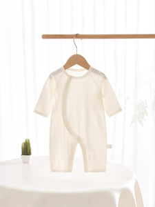 Breathable cotton baby romper with long sleeves and side opening in cream white