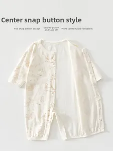 Detail of infant cotton romper showing breathable mesh fabric and squirrel print