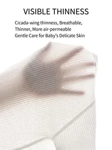 Thin breathable white cotton fabric for infant summer jumpsuits showing mesh texture