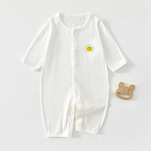 Detail of baby white long sleeve bodysuit with yellow smiley face print and snap closure
