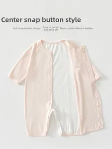 Close-up of pink baby bodysuit with breathable mesh lining and snap button closure