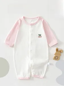 Detail of baby summer thin romper showing cherry embroidery and ribbed texture