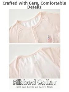 Detail view of pink baby romper featuring a ribbed neckline and swan embroidery design