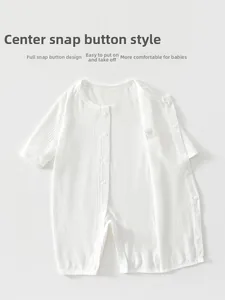 Detail of baby white waffle knit romper featuring full-length snap button closure