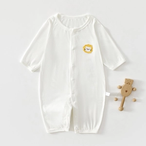 Close-up of white long sleeve baby romper with breathable mesh back and lion patch