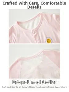 Close-up of pink breathable mesh baby bodysuit with soft neckline and smile print