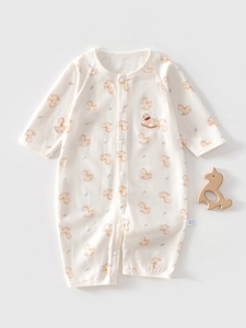 Detail of baby cotton romper with Trojan horse embroidery and snap button closure