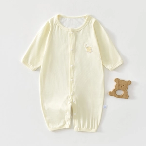 Detail of baby romper with elephant embroidery and soft ribbed fabric texture