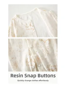 Detail of resin snap buttons on baby cotton bodysuit with brown forest animal patterns