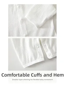 Detail of baby waffle knit romper showing ribbed cuffs and durable resin snap buttons